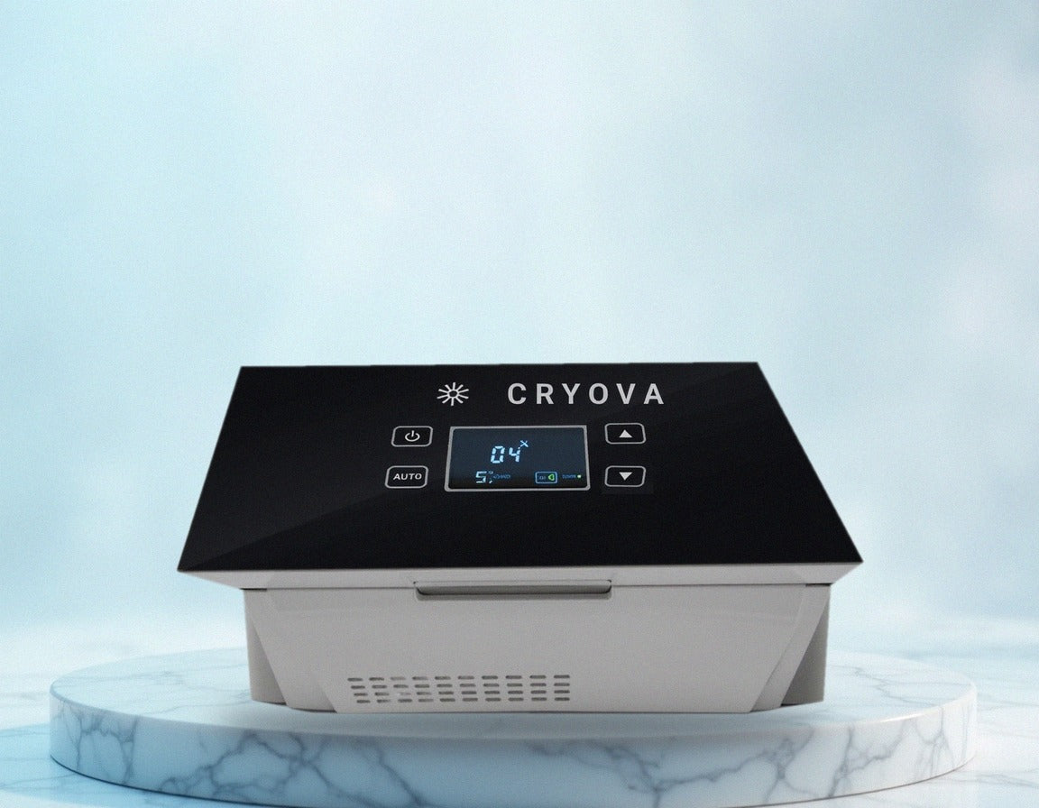 Cryova portable fridge on a marble podium: white body, black glass touch panel